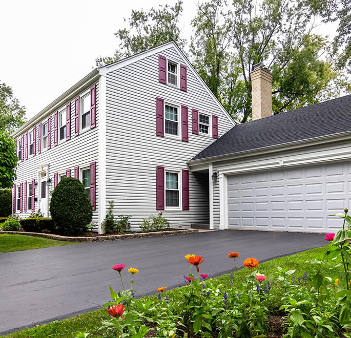 Home with asphalt driveway