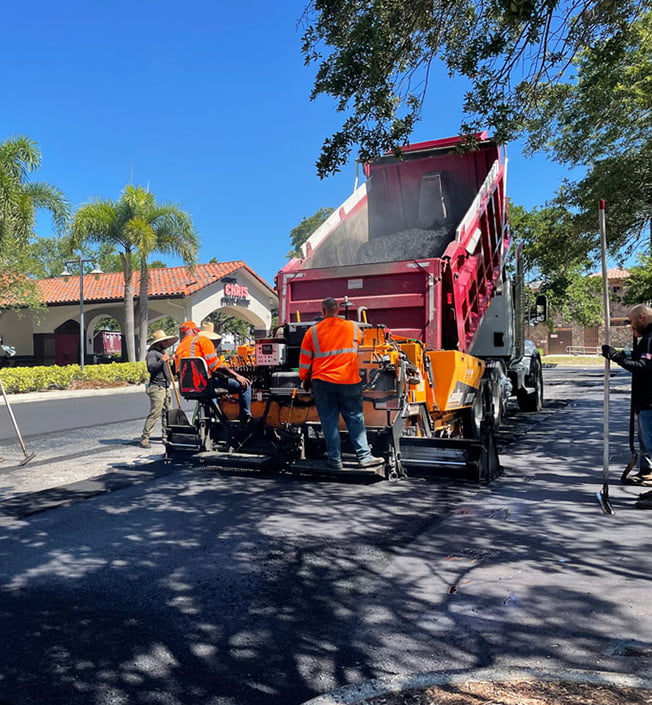 Workers paving the road