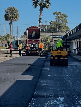 Workers resurfacing the asphalt